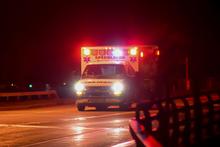 Ambulance on nighttime roadway